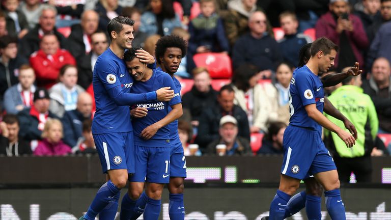 STOKE ON TRENT, ENGLAND - SEPTEMBER 23:  Pedro (2nd L) of Chelsea celebrates scoring his side's second goal with his team mates during the Premier League m