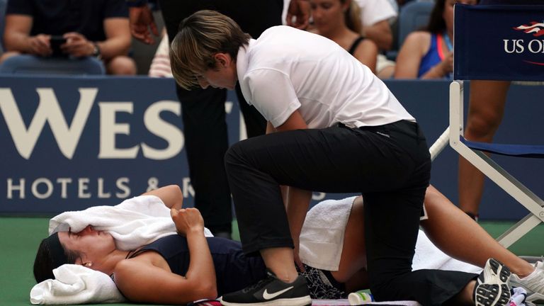 Anastasija Sevastova of Latvia gets a medical time-out on the court while playing against Sloane Stephens of the US during their US Open 2017 quarterfinal 