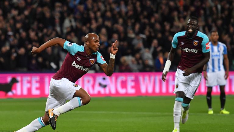 West Ham United's French-born Ghanaian midfielder Andre Ayew (L) celebrates after scoring their second goal during the English Premier League football matc