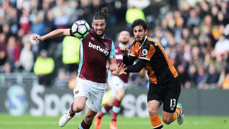 Andy Carroll and Andrea Ranocchia battle for possession during the Premier League match between Hull City and West Ham United on April 1, 2017