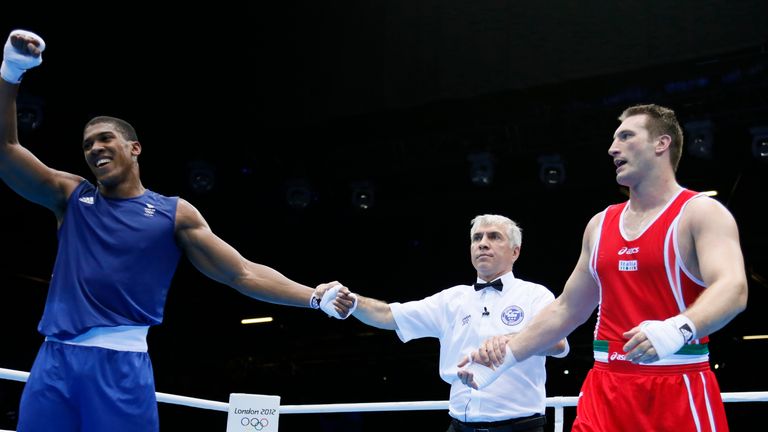 Anthony Joshua of Great Britain is declared gold medal winner over Roberto Cammarelle of Itay in the Super-Heavyweightboxing final.
