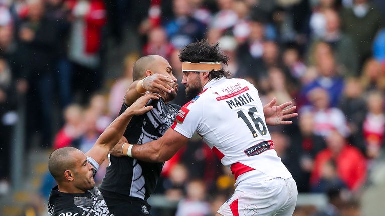 Leigh's Antoni Maria is tackled by Catalans' Sam Moa and Paul Aiton