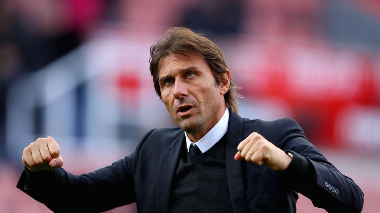 STOKE ON TRENT, ENGLAND - SEPTEMBER 23:  Antonio Conte, Manager of Chelsea celebrates his side's 4-0 victory after the Premier League match between Stoke C