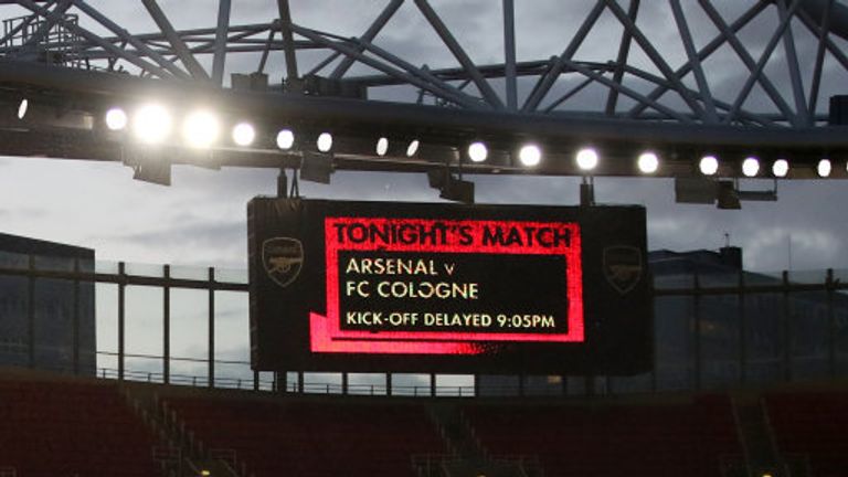 The giant screen shows that kick off is delayed for the Europa League match at the Emirates Stadium, London.