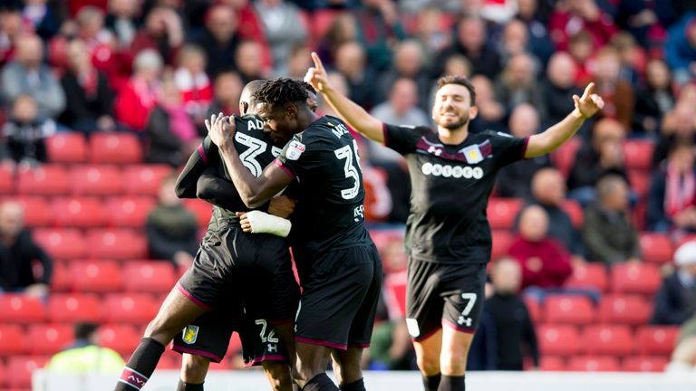 Albert Adomah celebrates with Aston Villa team-mates after scoring at Oakwell