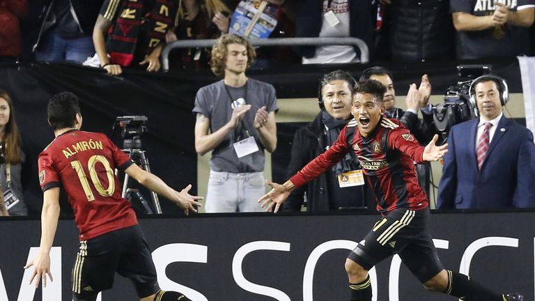 ATLANTA, GA - MARCH 05:  Midfielder Yamil Asad #11 of Atlanta United (right) celebrates with midfielder Miguel Almiron #10 after Asad scores the first goal