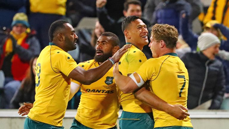 Israel Folau is congratulated by his team-mates after scoring Australia's first try
