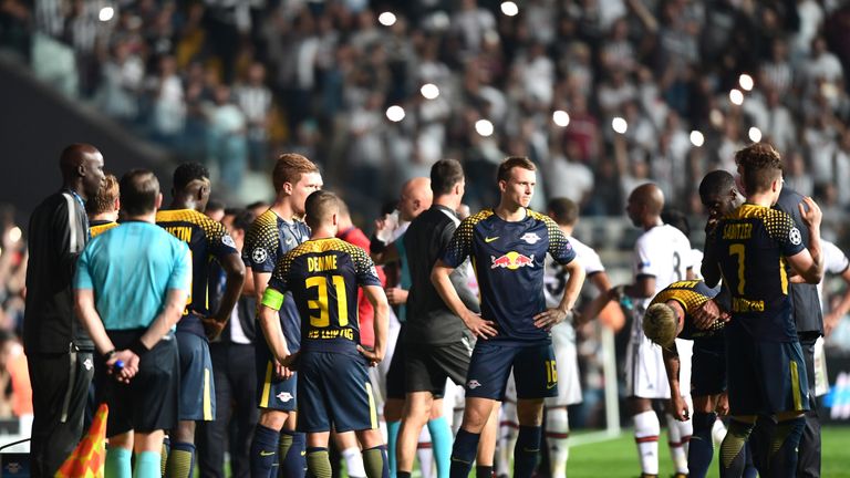 Leipzig's and Besiktas` players wait after a power failure during the UEFA Champions League group G football match between Besiktas and RB Leipzig at Vodaf