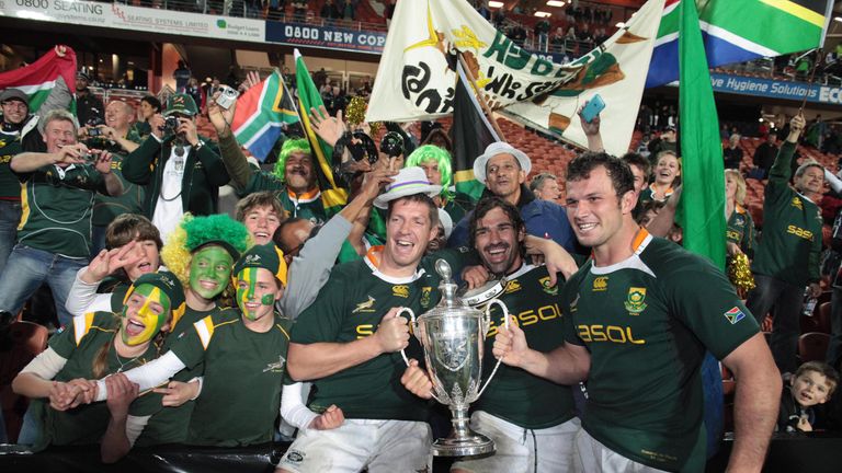 Bakkies Botha (L), Victor Matfield (C) and Bismarck Du Plessis (R) celebrate with the Tri Nations Cup following victory September 12, 2009