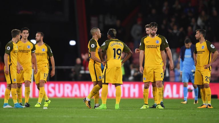 Brighton's players look dejected in defeat