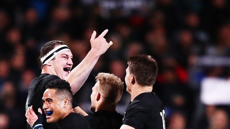 Brodie Retallick of the All Blacks celebrates after scoring a try with Aaron Smith, Damian McKenzie and Beauden Barrett