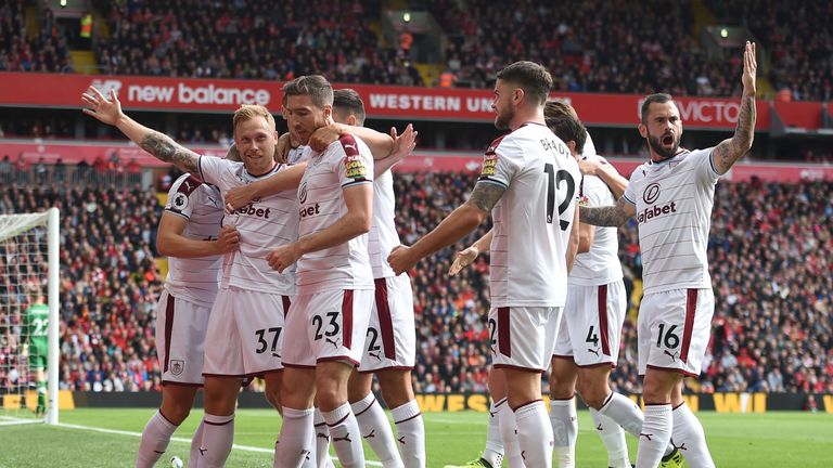 Burnley's Scott Arfield (2nd L) celebrates with teammates after scoring the opening goal of the English Premier League 