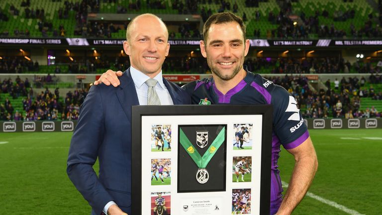 Cameron Smith (R) of the Storm poses with Darren Lockyer 