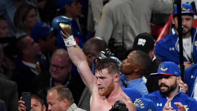 Canelo Alvarez celebrates after the final round against Gennady Golovkin in their WBC, WBA and IBF middleweight titles