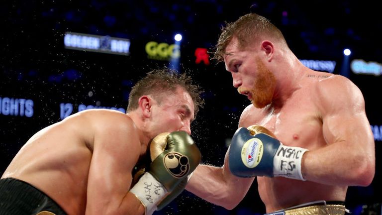  Canelo Alvarez throws a punch at Gennady Golovkin during their WBC, WBA and IBF middleweight championionship bout at T