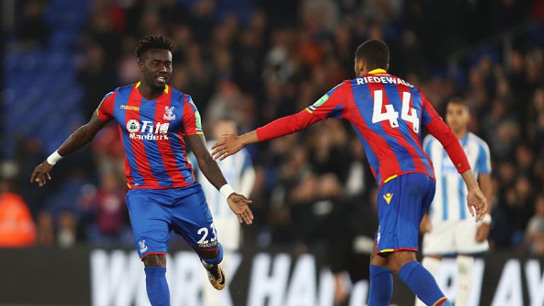 Pape Souare celebrates after coming on during the Carabao Cup tie against Huddersfield