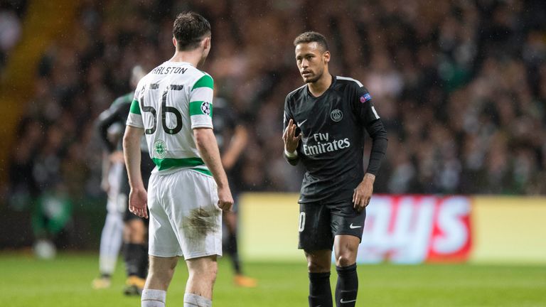 PSG's Neymar raises three fingers to Celtic's Anthony Ralston to remind him of the current score