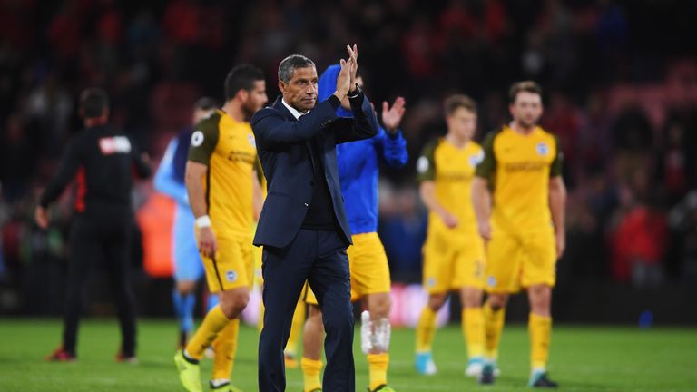 BOURNEMOUTH, ENGLAND - SEPTEMBER 15:  Chris Hughton, Manager of Brighton and Hove Albion applauds the travelling fans in defeat after the Premier League ma