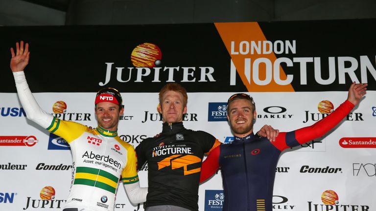 LONDON, ENGLAND - JUNE 06:  Elite Men's race winner Ed Clancy (c) of Condor JLT celebrates on the podium with Steel Von Hoff (r) and Chris Lawless (r) 