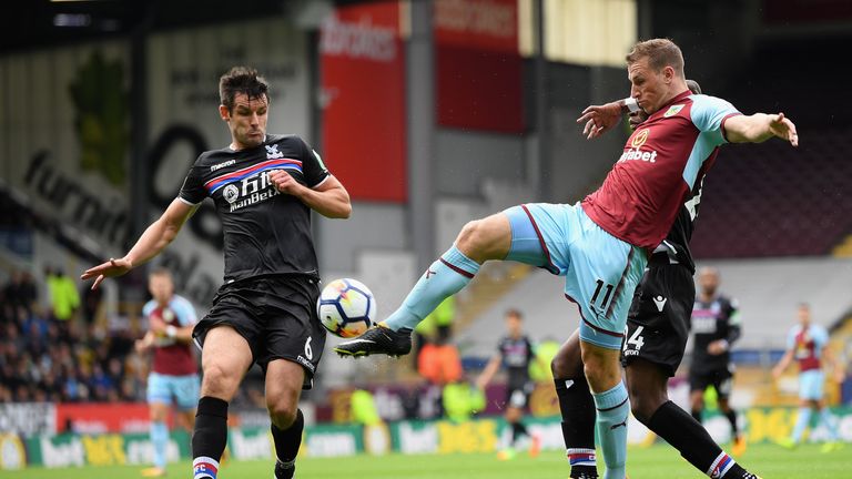 BURNLEY, ENGLAND - SEPTEMBER 10:  Chris Wood of Burnley shoots on goal under pressure from Luka Milivojevic of Crystal Palace during the Premier League mat