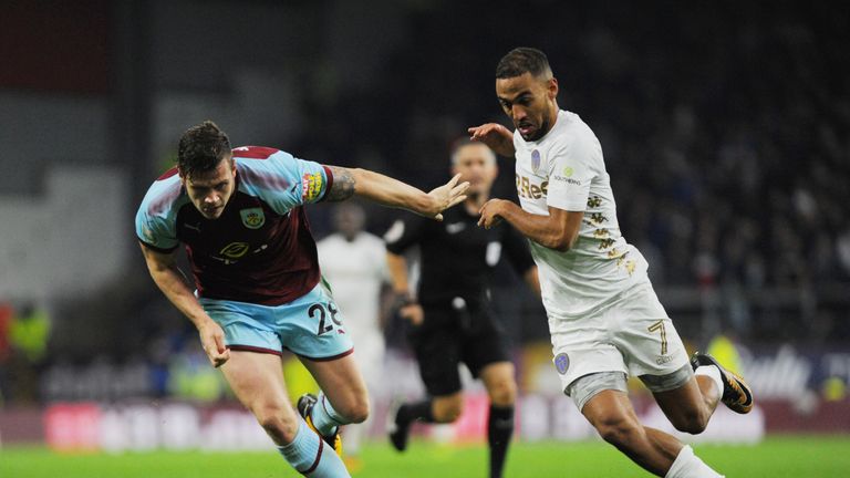 BURNLEY, ENGLAND - SEPTEMBER 19: Kemar Roofe of Leeds and Kevin Long of Burnley in action during the Carabao Cup Third Round match between Burnley and Leed