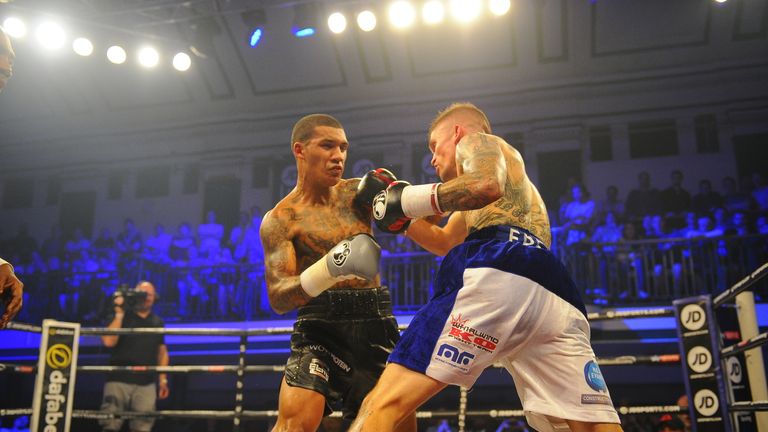 Conor Benn and kane Baker battle on the inside early on