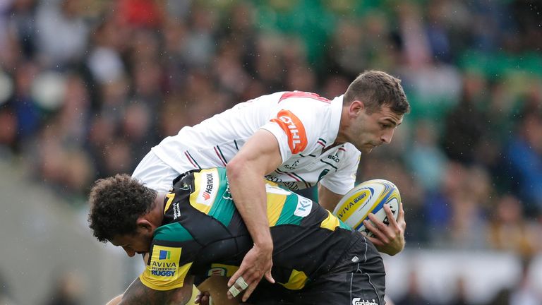 Courtney Lawes puts in a big tackle on Jonny May
