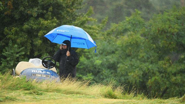 PRAGUE, CZECH REPUBLIC - SEPTEMBER 01:  An official looks on as play is suspended during day two of the D+D REAL Czech Masters at Albatross Golf Resort on 