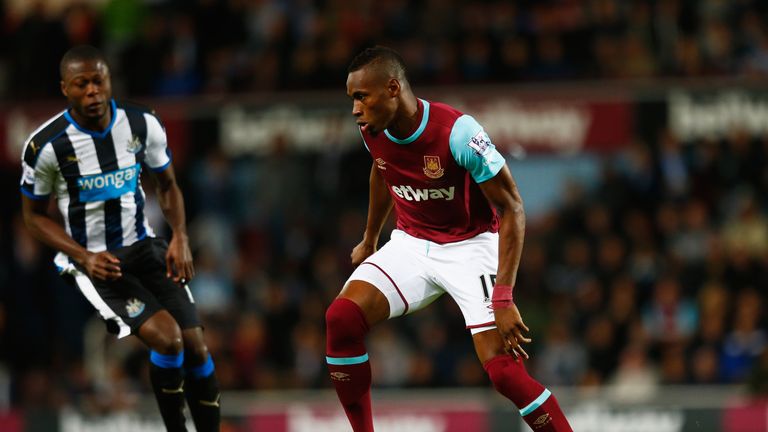 LONDON, ENGLAND - SEPTEMBER 14: Diafra Sakho of West Ham United is closed down by Chancel Mbemba of Newcastle United