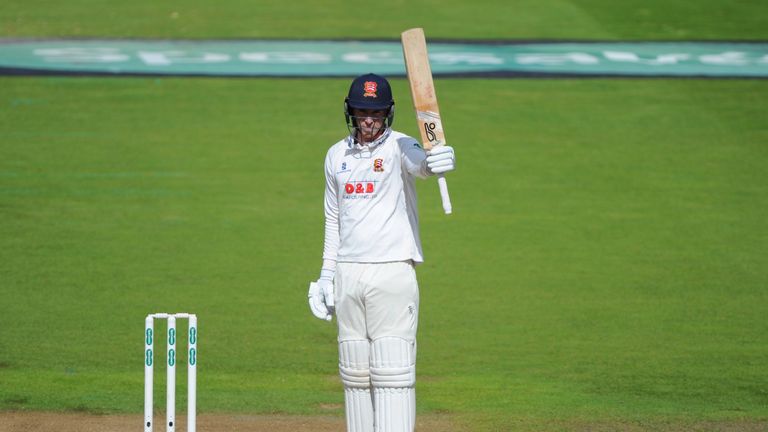 Dan Lawrence of Essex raises his bat after scoring a fifty during the County Championship