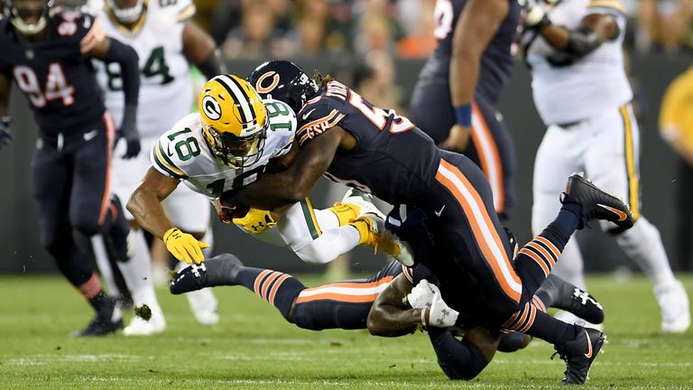 Randall Cobb #18 of the Green Bay Packers is tackled by Danny Trevathan #59 of the Chicago Bears