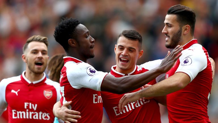 LONDON, ENGLAND - SEPTEMBER 09:  Danny Welbeck of Arsenal celebrates scoring his sides first goal with Granit Xhaka of Arsenal and Sead Kolasinac of Arsena