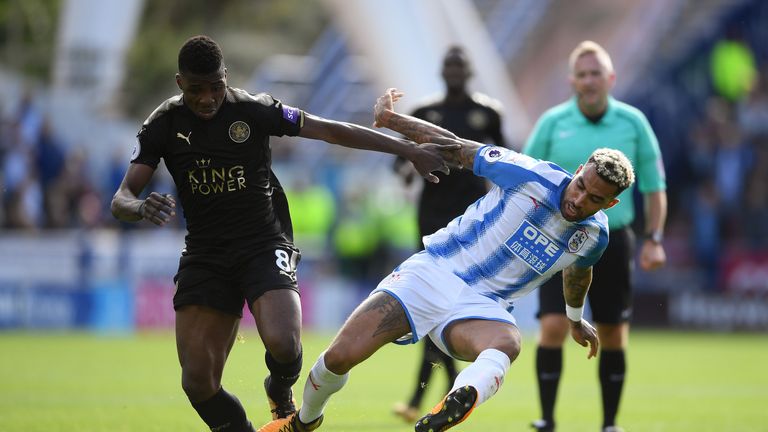 HUDDERSFIELD, ENGLAND - SEPTEMBER 16: Kelechi Iheanacho of Leicester City and Danny Williams of Huddersfield Town battle for possession during the Premier 