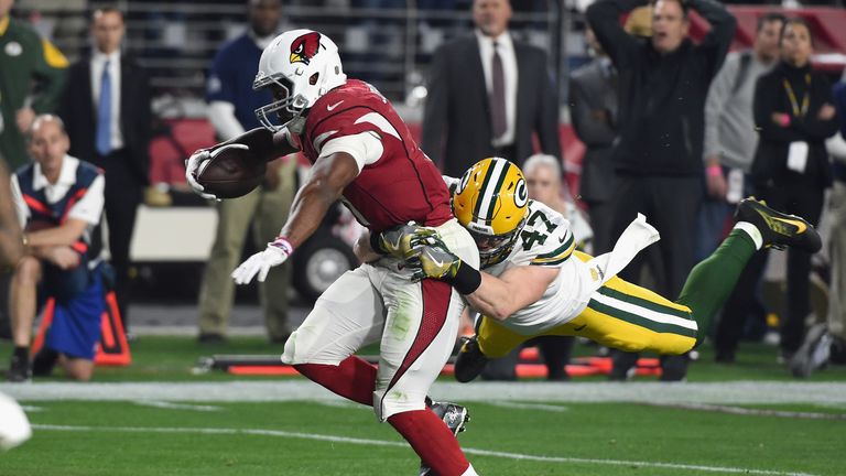 GLENDALE, AZ - JANUARY 16: Running back David Johnson #31 of the Arizona Cardinals is hit by inside linebacker Jake Ryan #47 of the Green Bay Packers durin