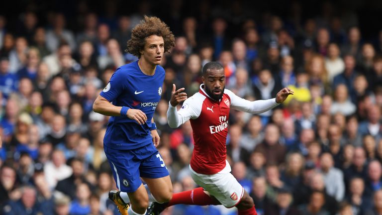 David Luiz of Chelsea attempts to take the ball away from Alexandre Lacazette of Arsenal during the Premier League match