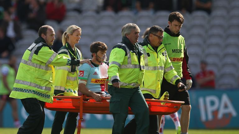 Demetri Catrakilis leaves the field after getting a throat  injury 