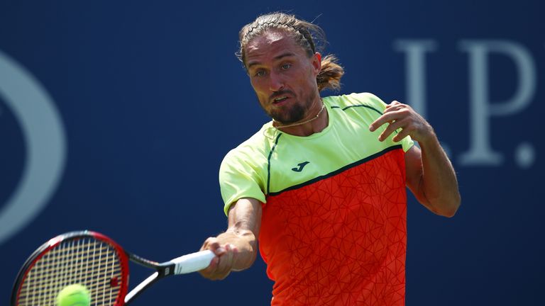 NEW YORK, NY - AUGUST 31:  Alexandr Dolgopolov of Ukraine returns a shot against Tomas Berdych of Czech Republic in their second round Men's Singles match 