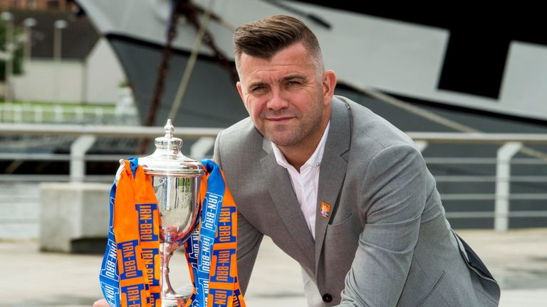 Former Scotland defender Dominic Matteo makes the draw for the third round of the Irn-Bru Cup.