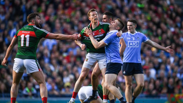  Donal Vaughan tackles John Small  and gets a red card. Small also gets a red card for his foul on  Colm Boyle.