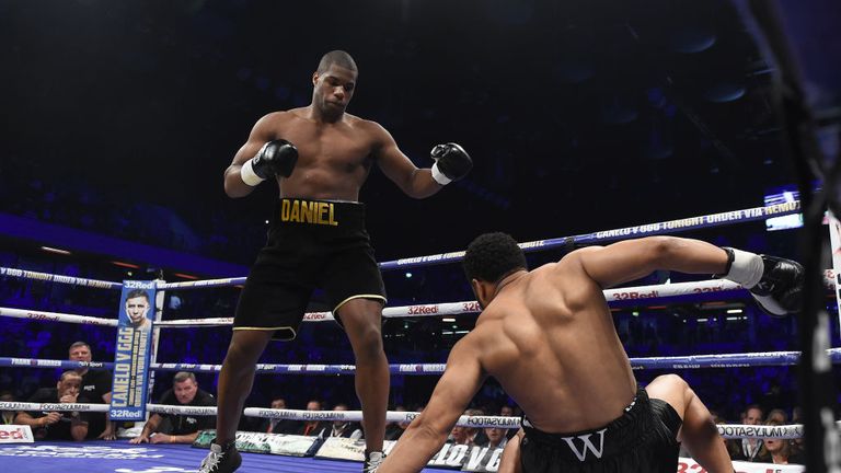  Daniel Dubois knocks down AJ Carter during the vacant BBBofC Southern Area Heavyweight Title fight  at Copper Box Arena on
