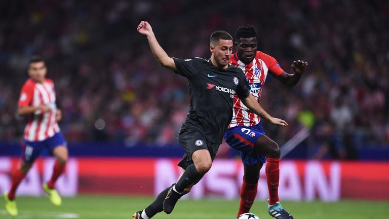 MADRID, SPAIN - SEPTEMBER 27:  Thomas Partey of Atletico Madrid chases down Eden Hazard of Chelsea during the UEFA Champions League group C match between A