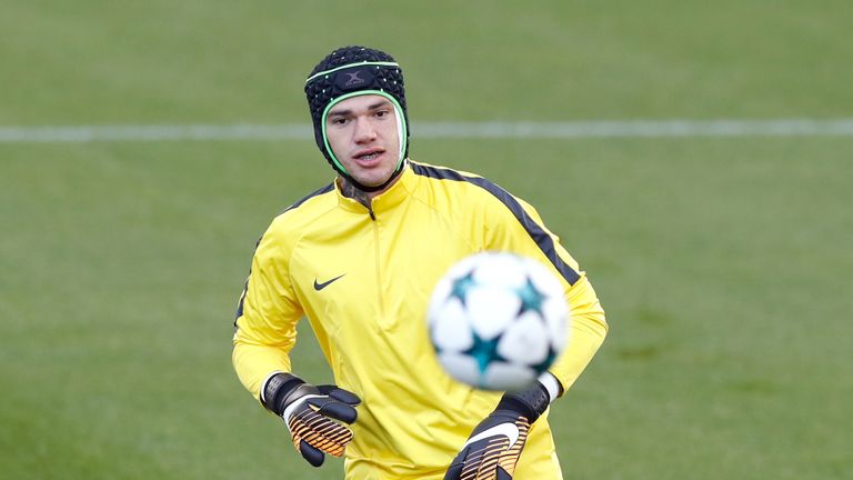 Ederson wears protective headgear during training after a collision with Liverpool's Sadio Mane last weekend left him needing stitches