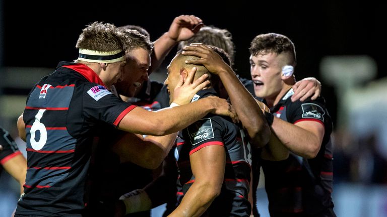 Edinburgh's Robbie Fruean celebrates scoring a try with teammates.Mandatory Credit ..