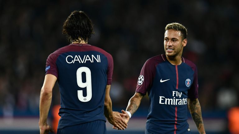 Paris Saint-Germain's Uruguayan forward Edinson Cavani (L) and Paris Saint-Germain's Brazilian forward Neymar shake hands during the UEFA Champions League 