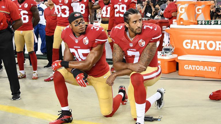  Colin Kaepernick #7 and Eric Reid #35 of the San Francisco 49ers kneel in protest during the national