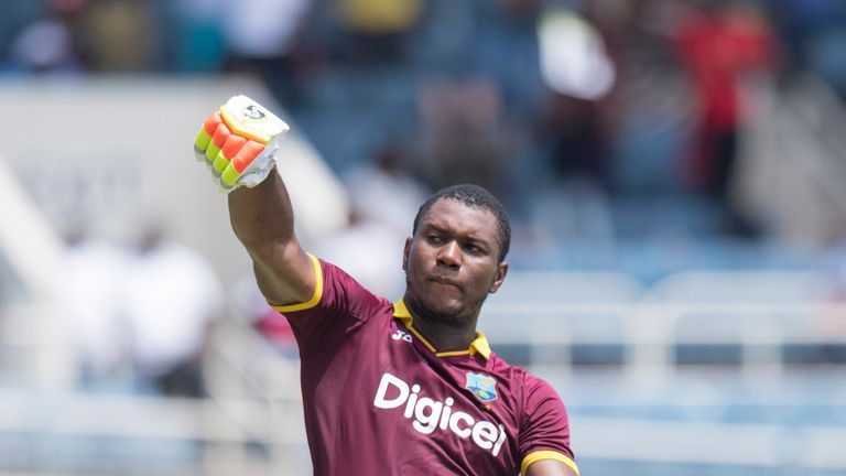 West Indies' Evin Lewis celebrates scoring a century during the T20 match between West Indies and India at the Sabina Park Cricket Ground in Kingston, Jama