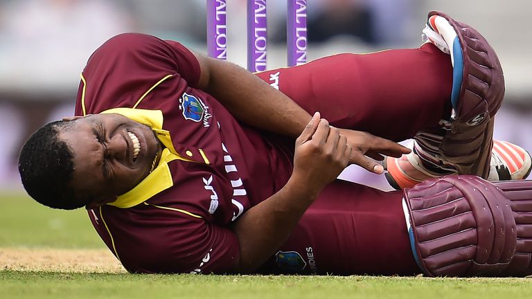 Windies' Evin Lewis reacts after being hit by the ball during the fourth One-Day International (ODI) cricket match between England and the Windies 