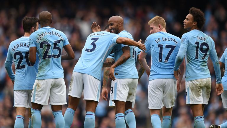 Manchester City's English midfielder Fabian Delph celebrates after scoring their fifth goal with Manchester City's Brazilian defender Danilo during the Eng