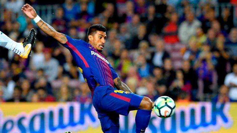 Paulinho jumps for the ball during the Spanish Liga football match Barcelona vs Espanyol at the Camp Nou stadium