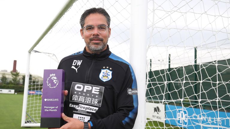 David Wagner poses with the Barclays Manager of the Month Award for August